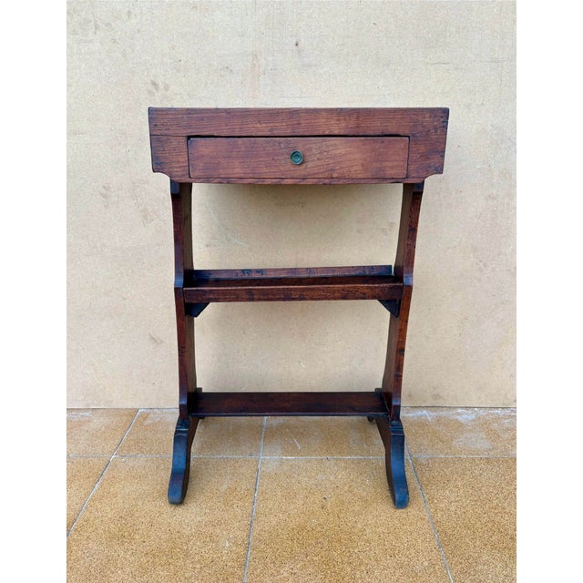 Charming antique rustic side table from Spain, dating to around 1900. Crafted in solid ches tu, this piece features a...