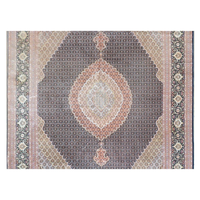 An unbelievable vintage tabriz rug with a mesmerizing traditional stylized fish pattern arranged with multiple medallions...