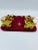 This stunning set of golden "fleur de lis" napkin rings comes in the original corresponding wool pouch that features a...