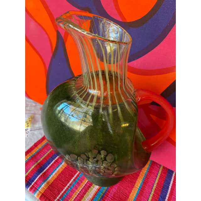 This is a very impressive piece of hand blown kosta boda art glass. It has wonderful internal striping with fired external...