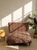 A fabulous 1950s chaise lounge with a dramatic low-slung silhouette, newly upholstered in bold blush and black tiger print...