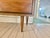 A classic mid-century modern six-drawer dresser attributed to Harmon House, featuring the clean lines, tapered legs, and...