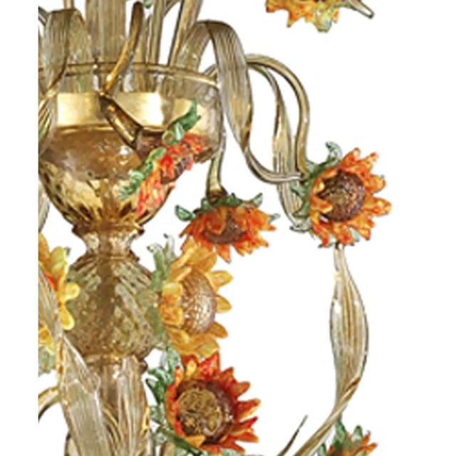 Venetian floreal chandelier made in amber and green Murano glass with sunflowers in yellow and orange paste. Full of...