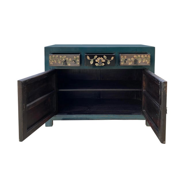 This is an oriental cabinet finished with distressed rustic teal green blue #305D71 and gray color with a mix of color...