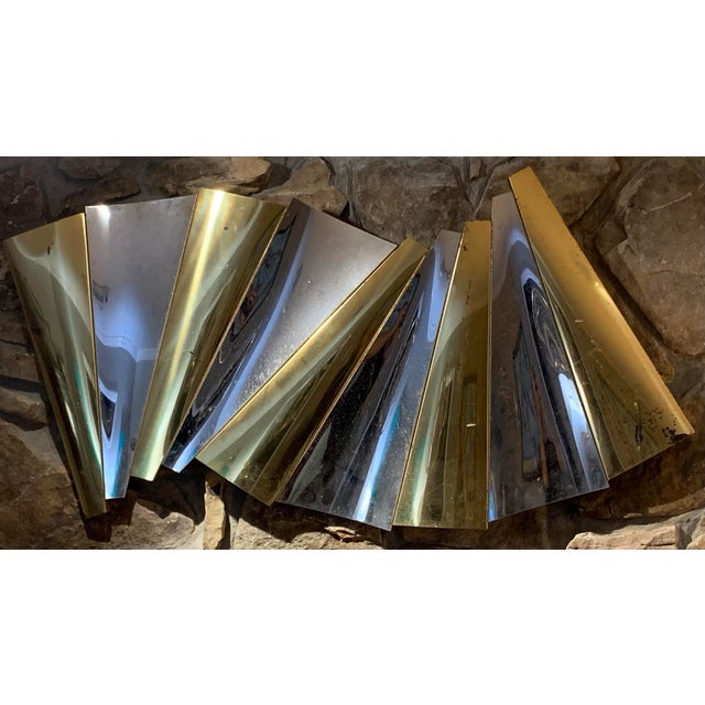 This metal silver and gold tone wave design wall art is in the style of metal artist Curtis Jere. This piece - with its...