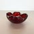 This original glass shell bowl was produced in the 1970s in Murano, Italy. An elegant purple red Murano glass element...