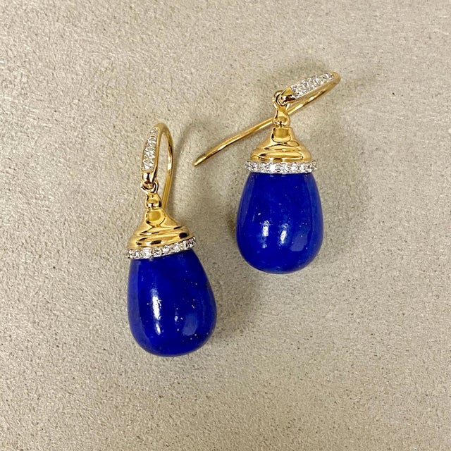 Created in 18kyg Lapis Lazuli 20 cts approx Diamonds 0.20 ct approx These exquisite earrings are a mesmerizing confection...
