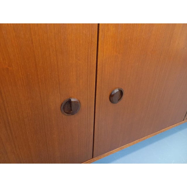 Vintage Scandinavian Modernist Style Sideboard in Teak and Black Metal, 1960s, in Very Good conditions. Designed 1960 to 1969