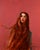 Curiosity by Ryan Morse | Oil on panel Portrait of a woman with long hair against a pink background For Sale
