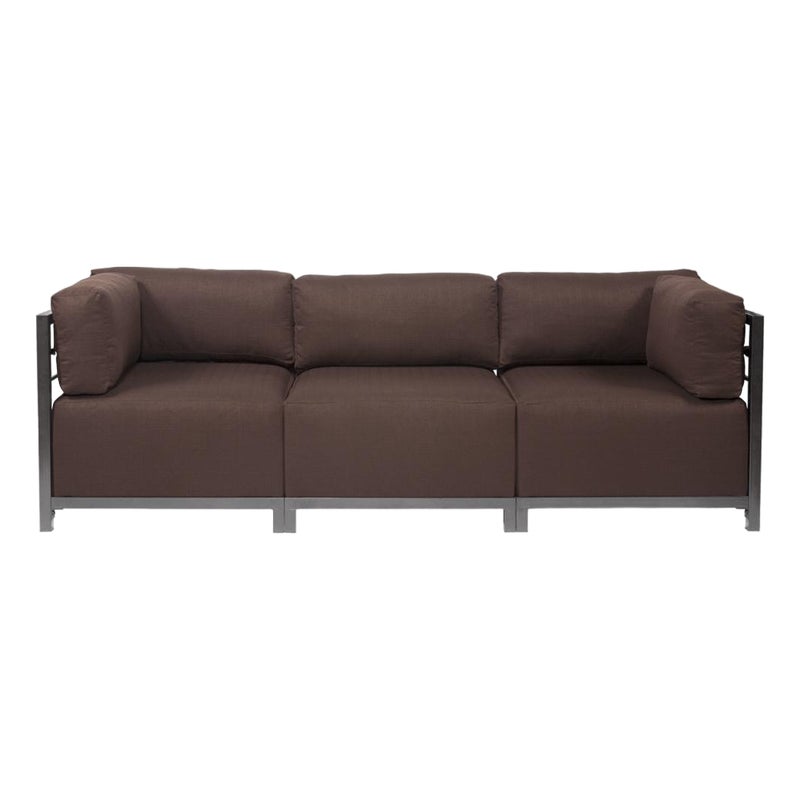 Brown sectional sofa with silver frame and cushions.