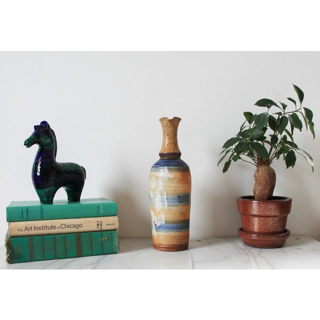 Vintage studio art pottery pitcher. Faintly signed by artist on bottom. No chips or cracks.