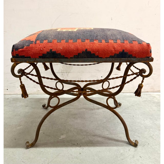 This vintage Spanish Revival–style ottoman features a beautifully sculptural wrought iron base with elegant scrollwork,...