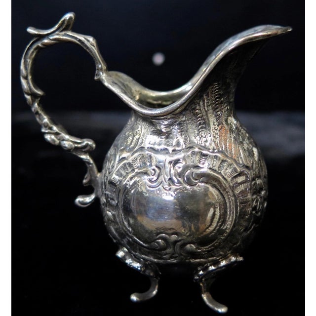 This vintage 19th century Continental 800 silver miniature tea set is designed for a child. The footed three piece silver...