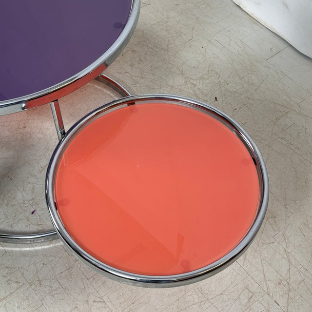 A sleek swivel-top glass coffee table by kare design, inspired by milo baughman’s iconic minimalist aesthetic. The...