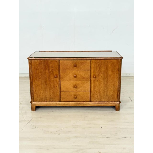 For sale is a beautiful vintage chest of drawers with clean lines and a functional design. with four drawers in the center...