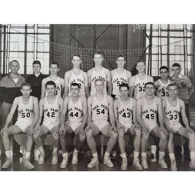 A 1950s Oak Park, Illinois High School basketball team photo. This vintage framed black & white photo exudes charm and...