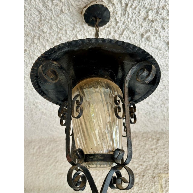 Pair of French iron and glass panel lanterns, circa 1960. Beautiful lanterns ideal for illuminating the garden. Up to 250V...