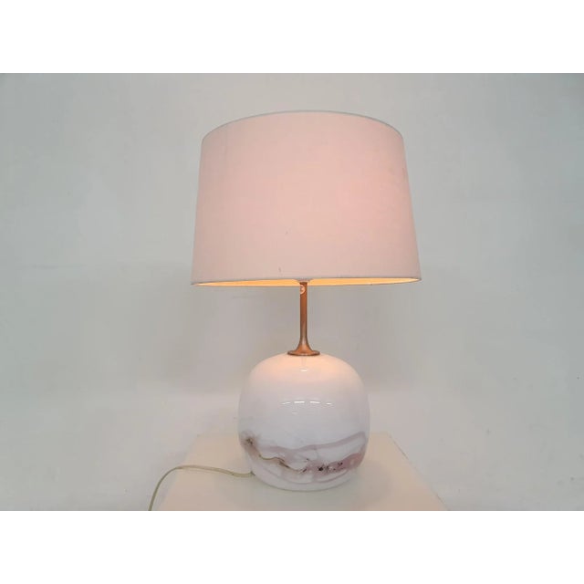 White and pink glass globe by Holmegaard and white (not original) lamp shade. Michael Bang This piece has an attribution...