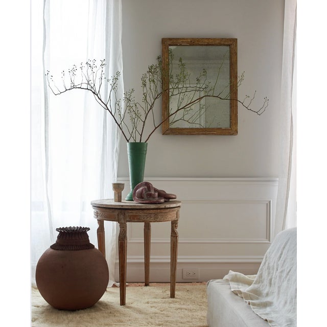 Empire-style carved wood base occasional table with blushy-nude marble top. Timeless and elegant