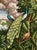 Stunning hand-painted panoramic scenic mural panel showcasing elegant peacocks resting amid lush tropical foliage, exotic...