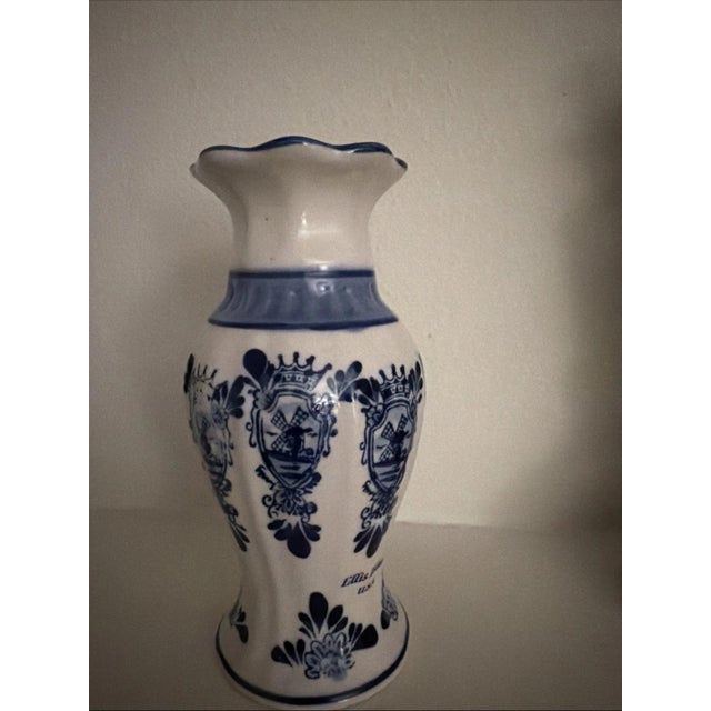 Elft Blue Ellis Island Bud Vase. Condition is Used.
