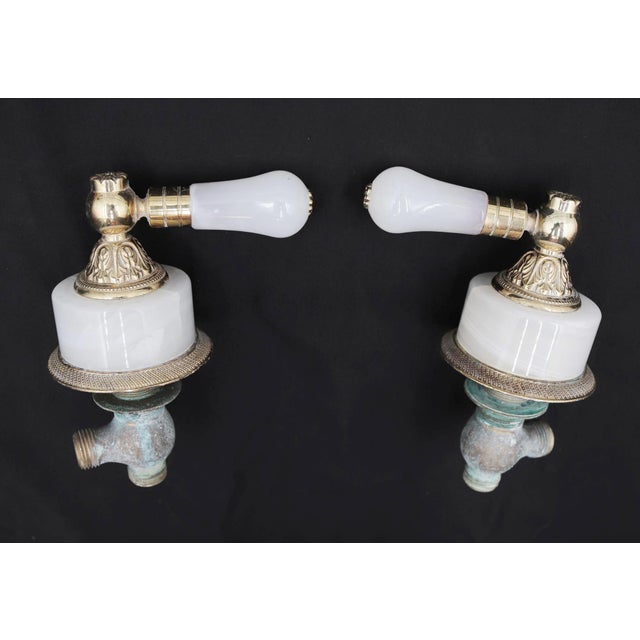 Traditional style luxury bathroom fixture set featuring two faucet handles and a towel bar. Stamped Spain. Good condition...