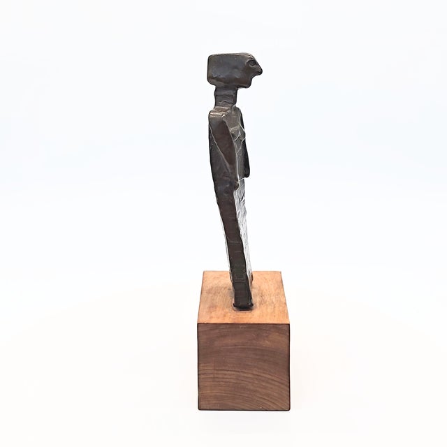 Standing Figure of a Woman Unknown, c. Mid-century Standing Figure of a Woman is compelling because it resists easy...