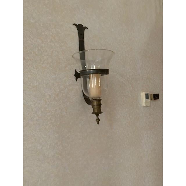 A large English glass belljar sconce with antiqued brass hardware and single interior candle. Circa 1960’’s. Height 31",...