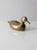This is a mid-century brass duck figurine. The heavy-weight brass duck has great lines, detail, and patina.
