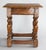 A superb antique 19th-Century English oak pegged joint stool with hand turned legs and beveled edge on the seat. It...