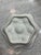 A distinctive antique French porcelain oyster plate featuring six deeply sculpted, shell-form wells arranged around a...