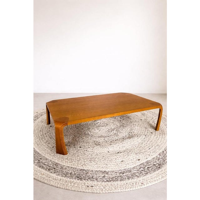 An original Tendo Mokko Japanese low table, representing one of the most refined expressions of post-war Japanese modern...