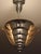 This round Art Deco chandelier by Petitot is made of chrome-plated brass and features three vertical, rose-colored,...