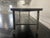 Vintage style metal industrial table on wheels, circa 2000 Industrial table made of steel on wheels.