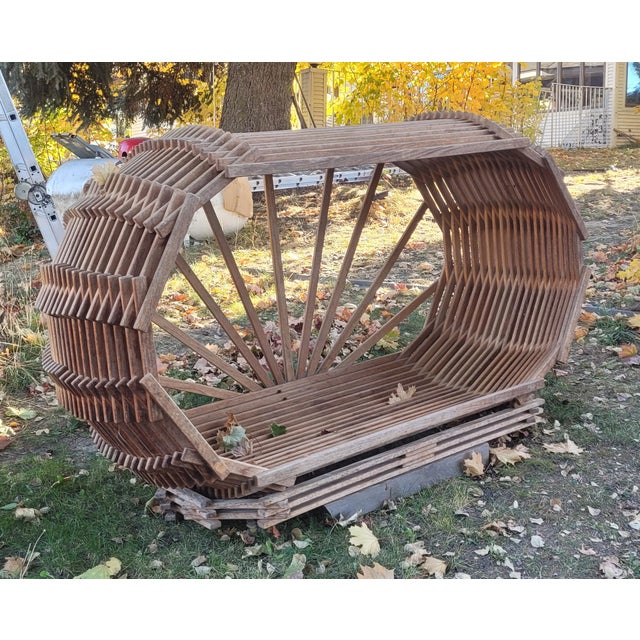 Sculptural Slatted Wood Cocoon Daybed With Architectural Oval Frame A striking marriage of sculptural artistry and...