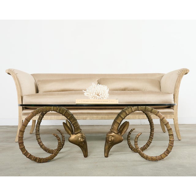 Handsome patinated brass lbex rams head coffee or cocktail table made in the manner and style of Alain Chervet, France....