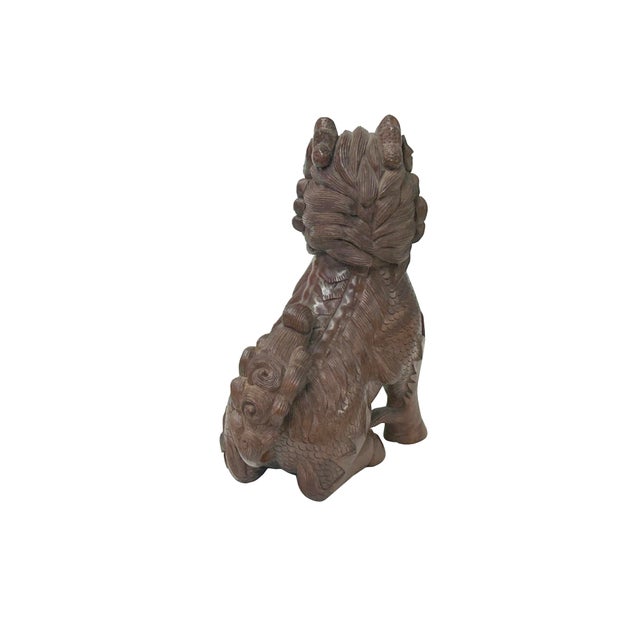 This vintage boxwood carving depicts a Kirin (or Qilin), a mythical chimera from East Asian mythology, captured in a...