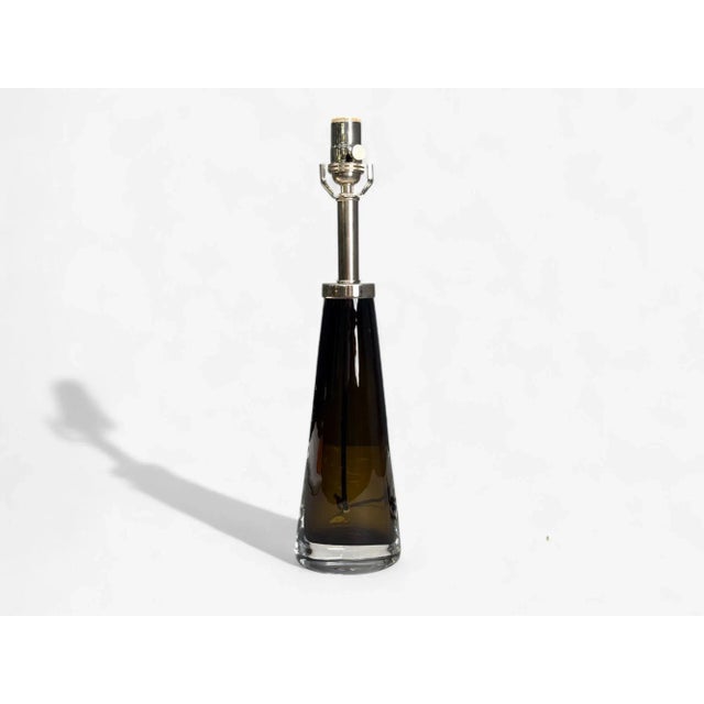 Nils Landberg, Swedish Modern, Brown Tinted Glass, Table Lamp, Sweden, 1960s A brown glass hourglass form table or desk...