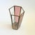 A tall vintage brass and glass candle holder. Hexagonal in shape with thin panes of pink and clear glass are held together...