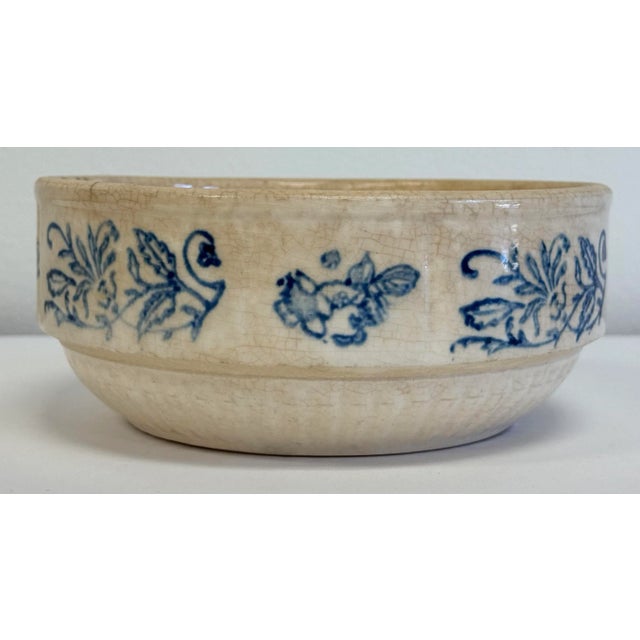 Antique primitive stoneware crock bowl often referred to as "Yellow Ware." Features a salt glaze for a shiny finish with...