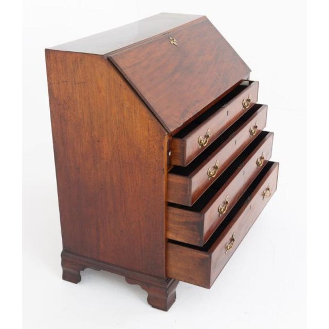 A fine Georgian mahogany bureau desk, raised on traditional bracket feet Circa 1800 The lower section is fitted with four...