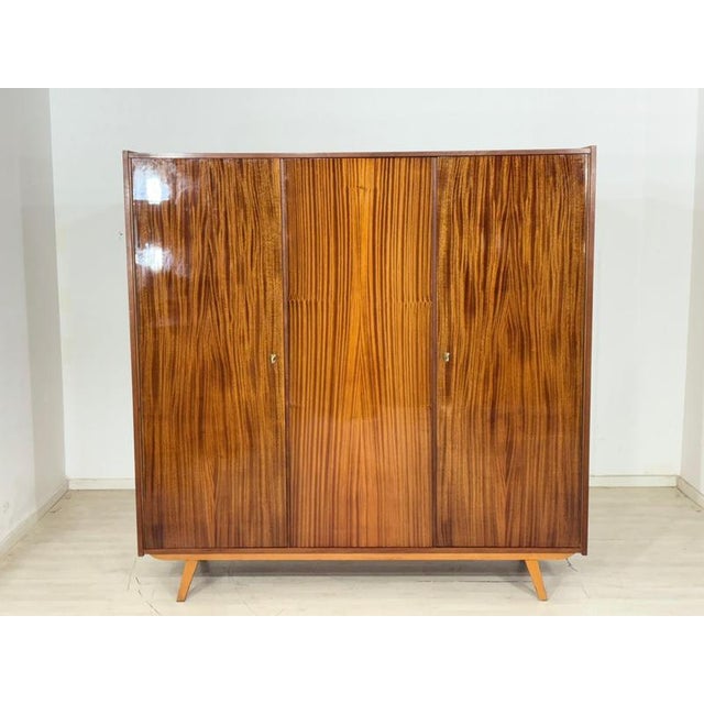 For sale is a large vintage wardrobe from the 1960s. This piece of furniture impresses with its simple mid-century design,...