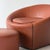 c. 1990s. Brown leather upholstery with zipper details Ottoman: 27L 27W 13H This piece is attributed to the mentioned...