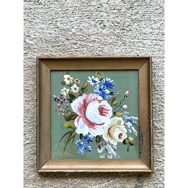This charming vintage floral oil painting celebrates the timeless beauty of botanical still-life artwork, featuring a...