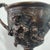 A wonderful bronze replica of this iconic drinking cup of the Greeks and Etruscans, mounted on a marble and wood base. 10"...