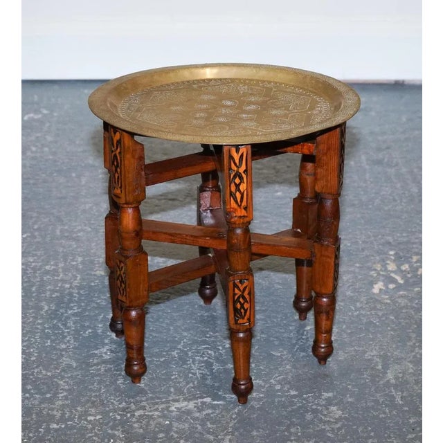 Lovely Moorish Moroccan Brass Table. The Moorish Moroccan brass folding tray table is a beautifully crafted piece of...