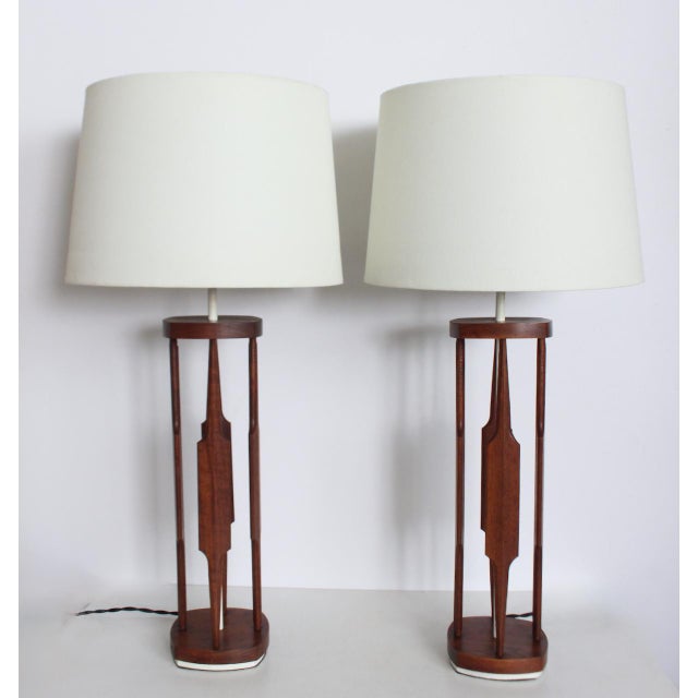 Pair Tony Paul for Westwood Industries Walnut & White "Modern Americana" Table Lamps. Featuring four sculpted, cut out...