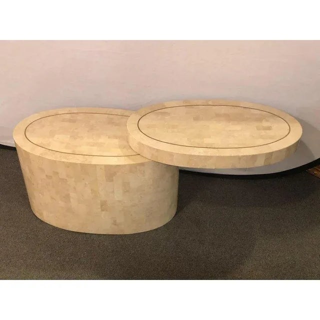 A striking Mid-Century Modern tessellated bone coffee or end table crafted in the style of Enrique Garcel, celebrated for...