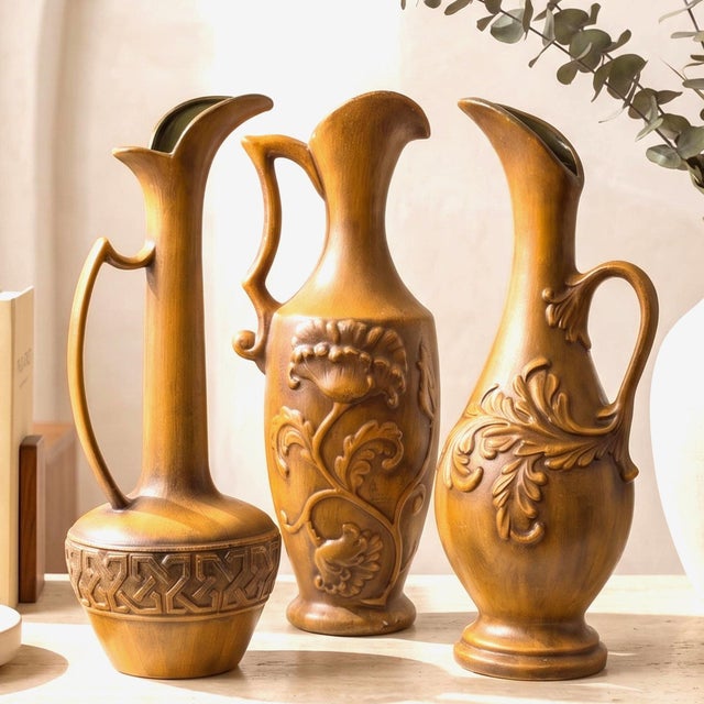 Set of three vintage Royal Haeger ewer vases in warm antique gold — collectible mid-century American art pottery, tall and...