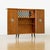 This fabulous mid century bar cabinet was made in England during the 1960s. An exceptional vintage dry bar cabinet...